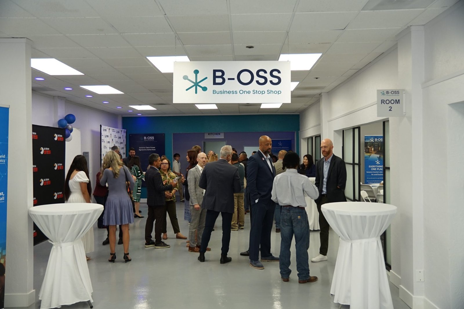 Business networking event under the B-OSS sign at the Santa Rosa hub