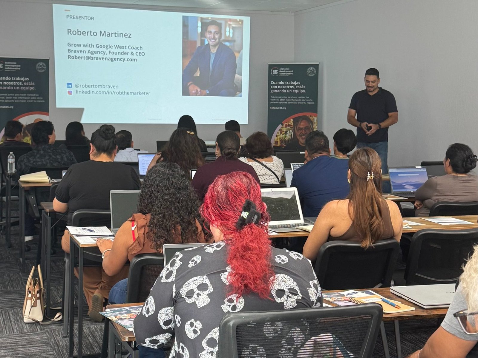 A bilingual business workshop in session in the B-OSS workshop room